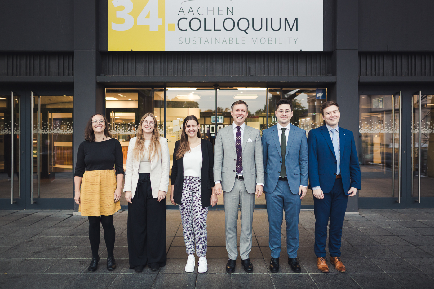 Group photo of the Aachen Colloquium planning team in front of the event venue.