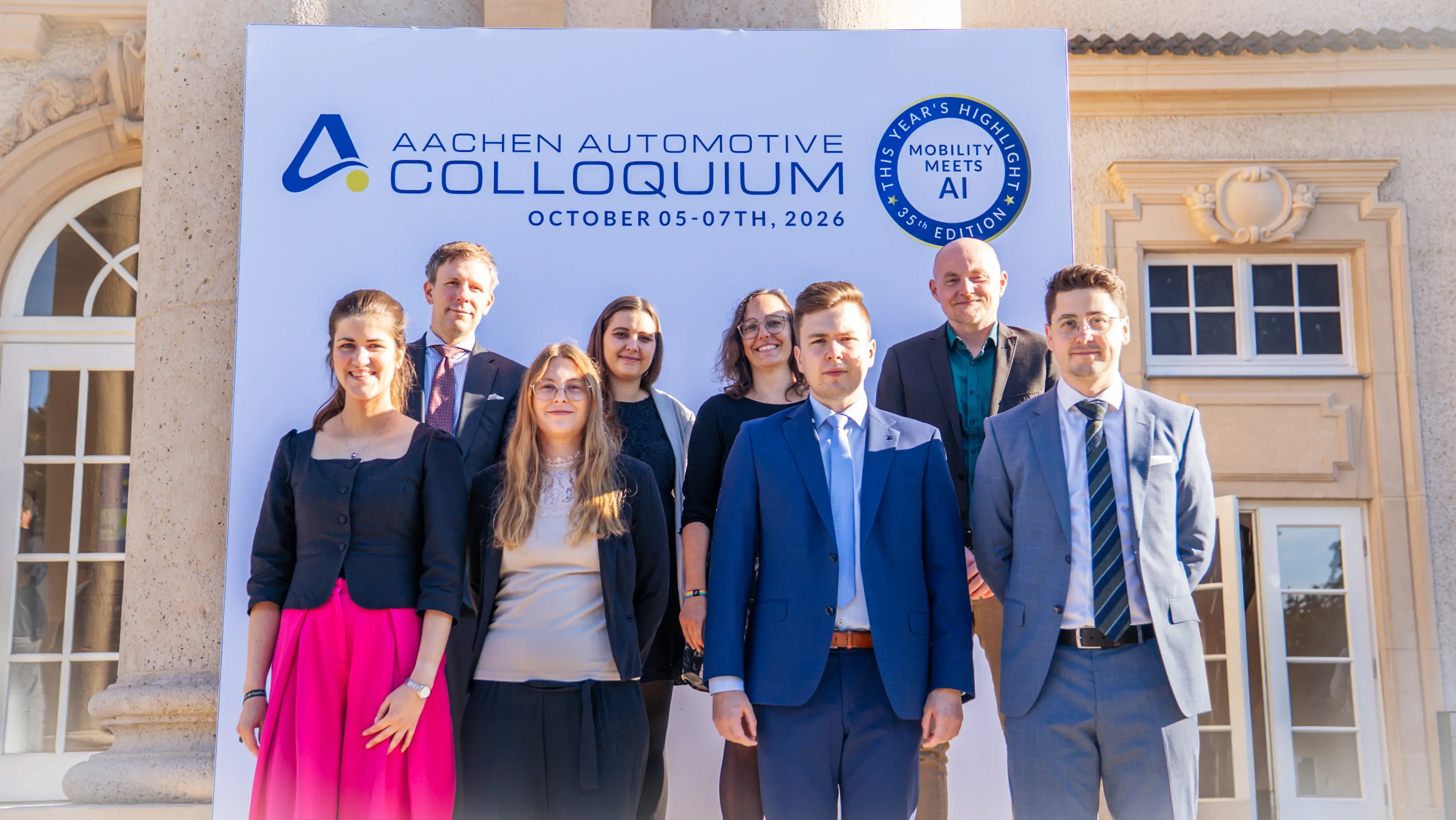 Group photo of the Colloquium planning team in front of the event venue.