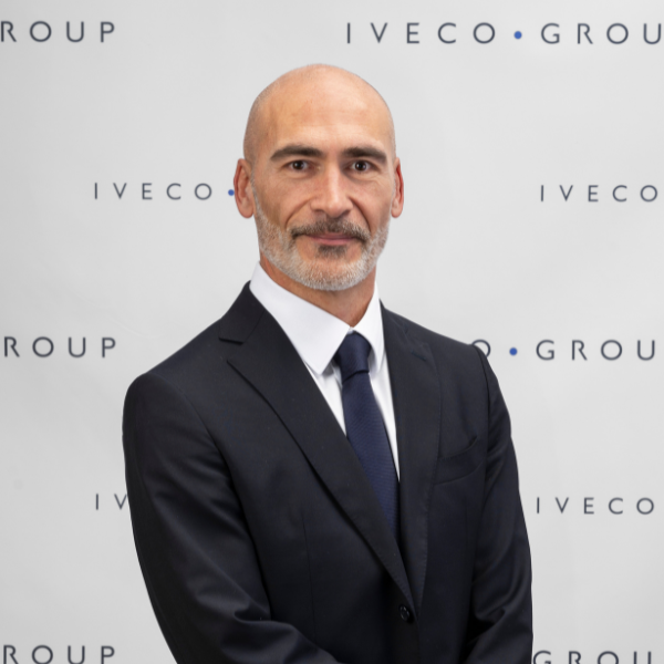Marco Liccardo standing in front of a white wall.